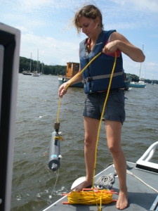 Lesley collecting a water sample.